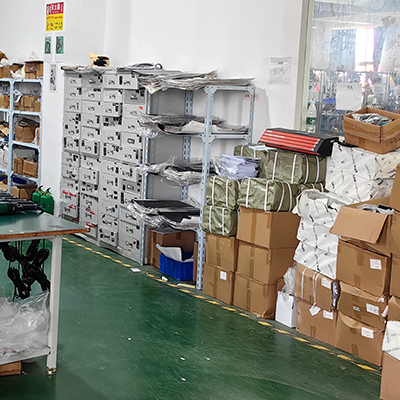 Interior of a warehouse with shelves and boxes, showcasing various car polisher and buffer polisher products, including dual action and rotary models, neatly organized for easy access and selection.