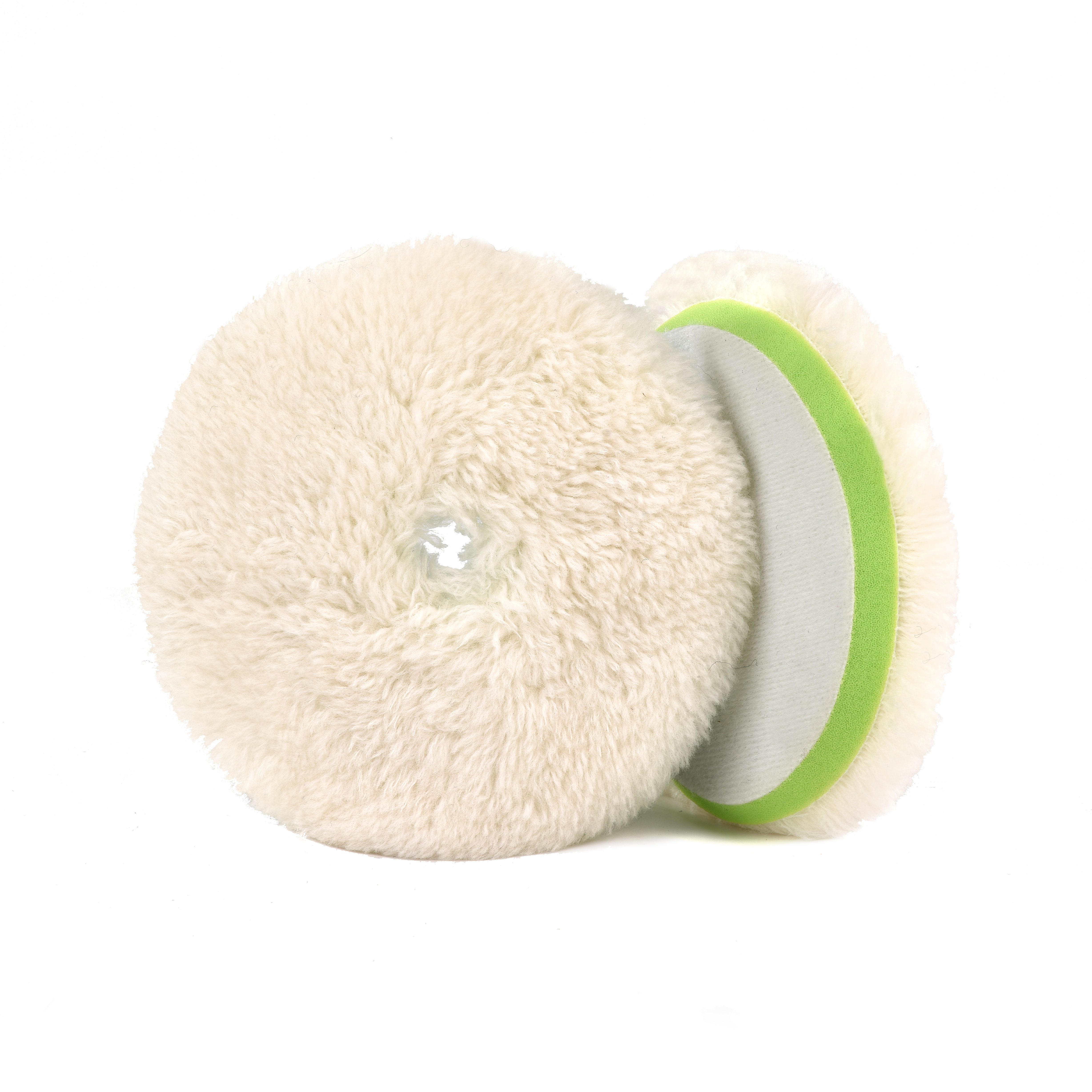 Professional detailer using different wool polishing pad sizes on a vehicle